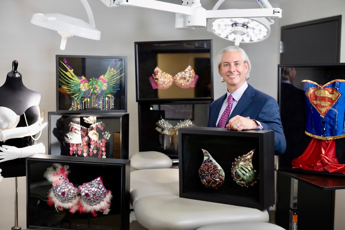 Dr. Snyder inside the private surgical suite, surrounded by framed art
